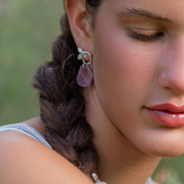  wearing pink ruby earrings 